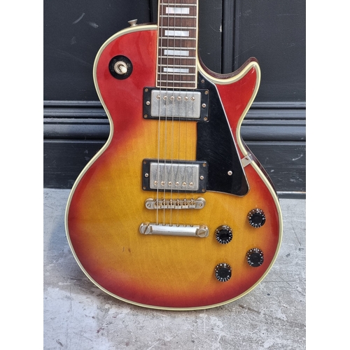 1404 - A circa 1970s Shaftsbury 'Les Paul' style 6-string electric guitar, with associated flight case.... 