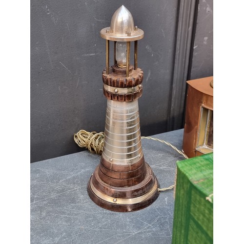 1423 - A steel four branch tripod candelabrum, 39cm high; together with a small reproduction pair of copper... 