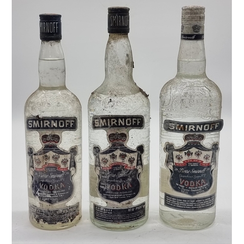 119 - Three bottles of Smirnoff Vodka, comprising: two 1 litre; and a 26 2/3 fl.oz. example. (3)... 