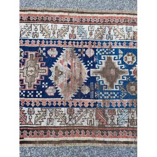 1013 - A Caucasian Kazak runner, having allover geometric decoration, 275 x 100cm.