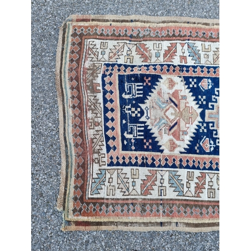 1013 - A Caucasian Kazak runner, having allover geometric decoration, 275 x 100cm.