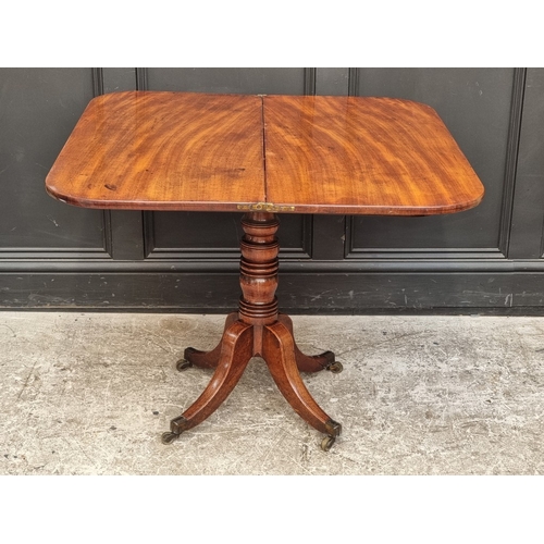 1051 - A George IV mahogany and ebony inlaid pedestal tea table, 91cm wide.