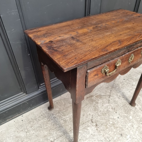 1052 - An 18th century oak single drawer side table, 76cm wide, (alterations).
