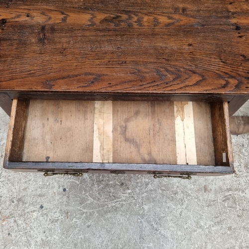 1052 - An 18th century oak single drawer side table, 76cm wide, (alterations).
