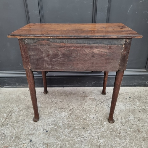 1052 - An 18th century oak single drawer side table, 76cm wide, (alterations).