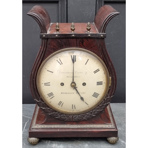 1138 - A good Regency rosewood and brass mounted lyre form twin fusee mantel clock, the 7in painted circula... 