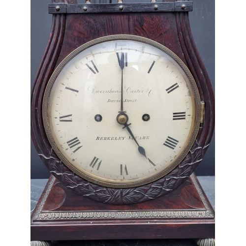 1138 - A good Regency rosewood and brass mounted lyre form twin fusee mantel clock, the 7in painted circula... 