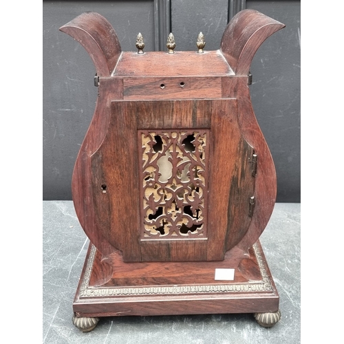 1138 - A good Regency rosewood and brass mounted lyre form twin fusee mantel clock, the 7in painted circula... 