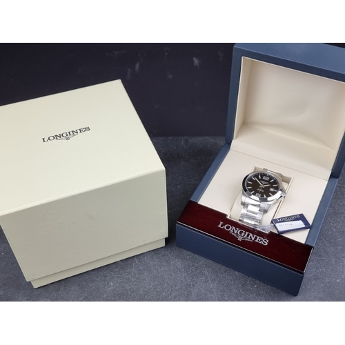 315 - A Longines 'Conquest' stainless steel automatic wristwatch, 41mm, Ref. L3.777.4, on original bracele... 