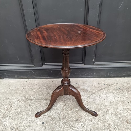 1103 - A George III mahogany tripod table, with dished one-piece tilt-top, 52.5cm wide, (repairs); together... 