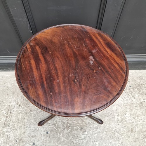 1103 - A George III mahogany tripod table, with dished one-piece tilt-top, 52.5cm wide, (repairs); together... 