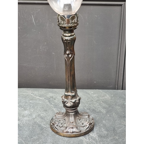 1412 - A pair of Art Nouveau style bronze storm lamps, total height 65cm, (crack to one glass shade).... 