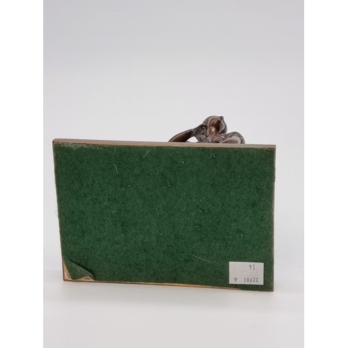 1509 - A bronze washerwoman, with marble inset base, 21cm high.