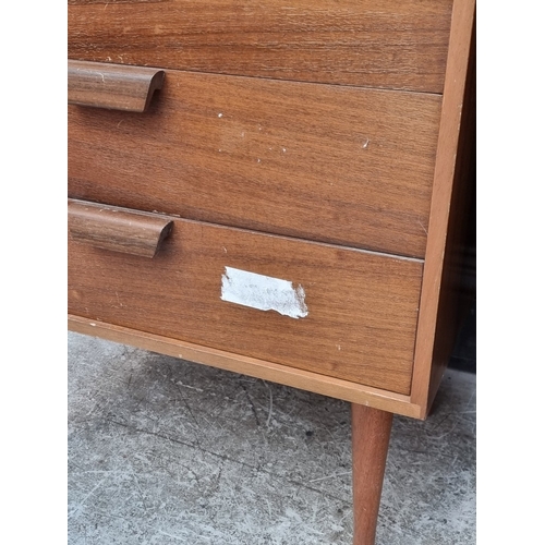 1011 - A pair of mid-century Uniflex teak tallboys, 111.5cm high x 63cm wide.