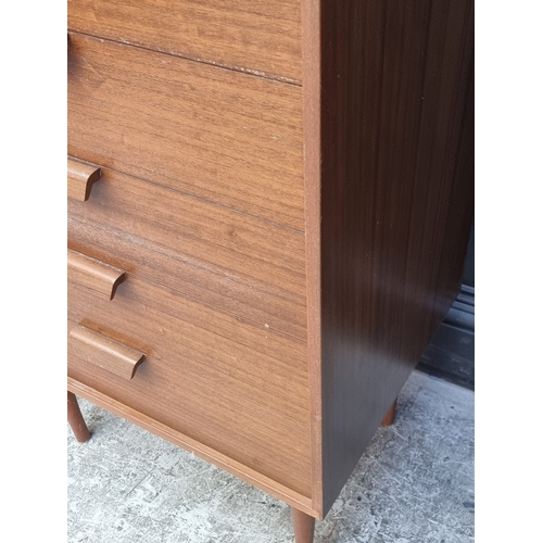 1011 - A pair of mid-century Uniflex teak tallboys, 111.5cm high x 63cm wide.