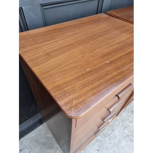 1011 - A pair of mid-century Uniflex teak tallboys, 111.5cm high x 63cm wide.