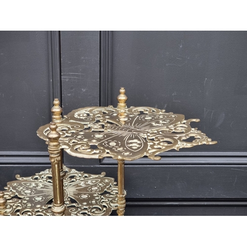 1020 - An unusual antique pierced brass plant stand, with three butterfly tiers, 77cm high.... 