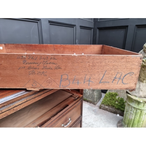1031 - A vintage stained teak three drawer chest, with brushing slide, the back edge of one drawer inscribe... 