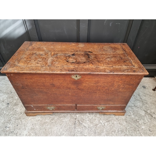 1034 - An 18th century oak mule chest, 109cm wide.
