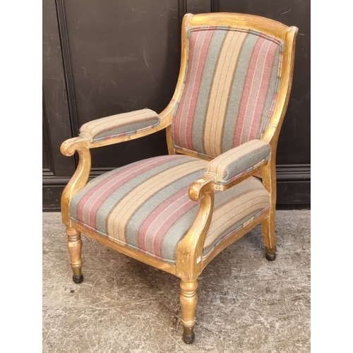 1061 - A 19th century giltwood and upholstered open arm occasional chair.By repute, from Windsor Castle.... 