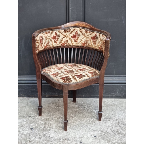 1063 - An Edwardian mahogany and inlaid tub chair.