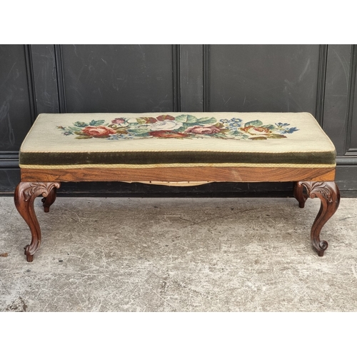 1069 - A Victorian carved rosewood and upholstered long stool, 110cm wide.