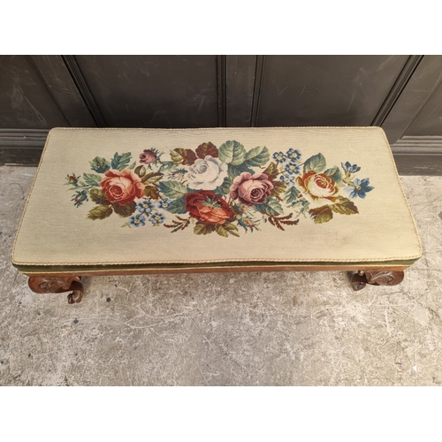 1069 - A Victorian carved rosewood and upholstered long stool, 110cm wide.