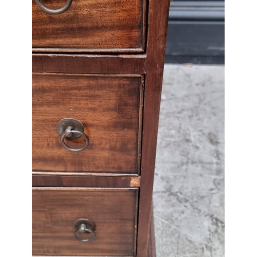 1071 - A 19th century mahogany pedestal desk, of free standing form, with dummy drawers and cupboards to th... 