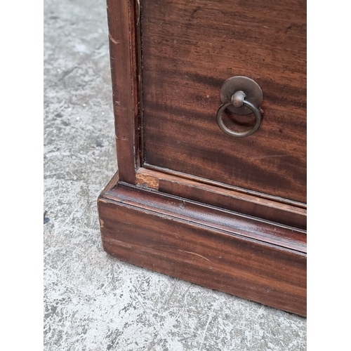1071 - A 19th century mahogany pedestal desk, of free standing form, with dummy drawers and cupboards to th... 