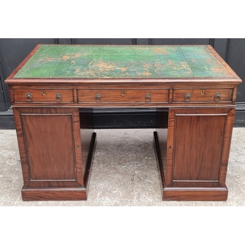 1071 - A 19th century mahogany pedestal desk, of free standing form, with dummy drawers and cupboards to th... 