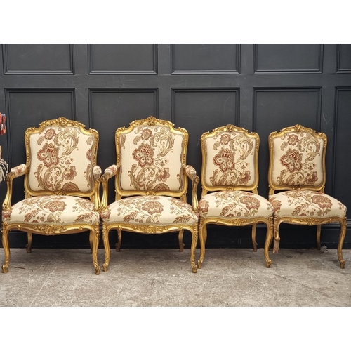 1072 - A Louis XV style carved giltwood and upholstered salon suite, comprising: a settee, 132cm wide; a pa... 