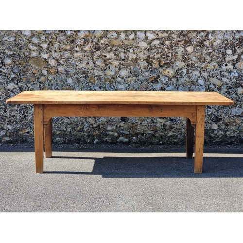 1076 - An old chestnut refectory table, probably French, with a three plank cleated end top above dummy fri... 