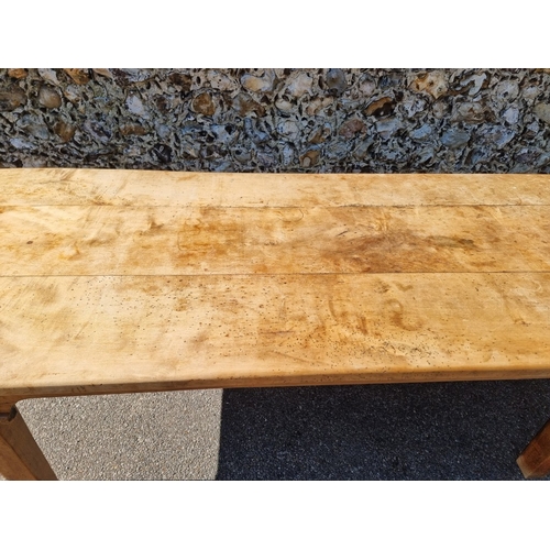 1076 - An old chestnut refectory table, probably French, with a three plank cleated end top above dummy fri... 