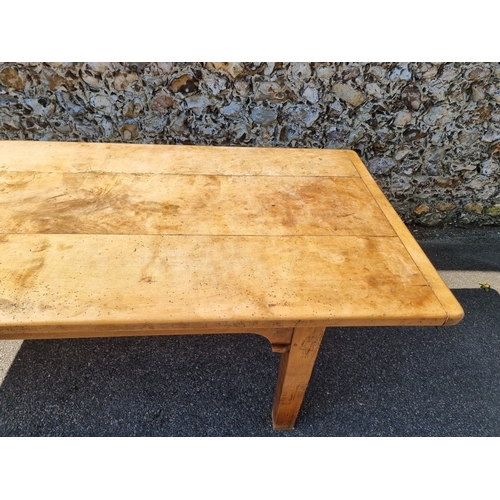 1076 - An old chestnut refectory table, probably French, with a three plank cleated end top above dummy fri... 