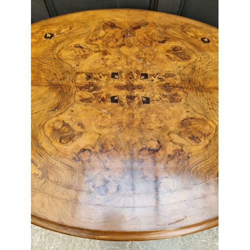 1082 - A Victorian figured walnut and inlaid oval tilt-top loo table, 118cm wide.