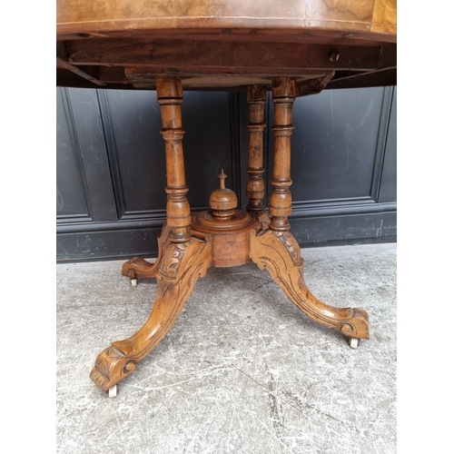 1082 - A Victorian figured walnut and inlaid oval tilt-top loo table, 118cm wide.