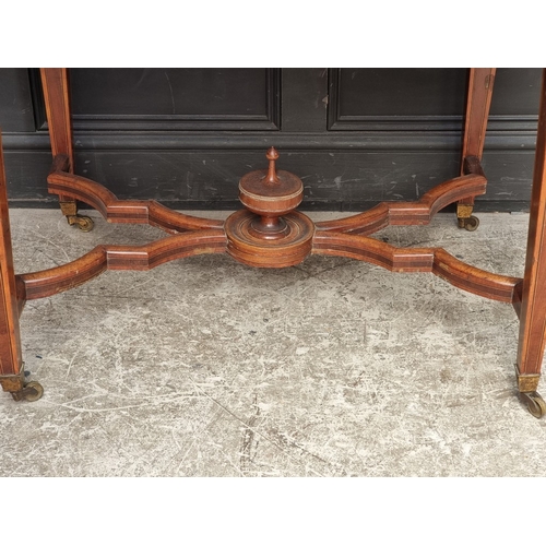 1083 - A late Victorian mahogany, satinwood crossbanded and inlaid centre table, with a frieze drawer and o... 