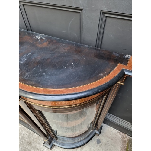 1084 - A Victorian ebonized, burr yew and inlaid credenza, incorporating a Sevres style porcelain panel and... 