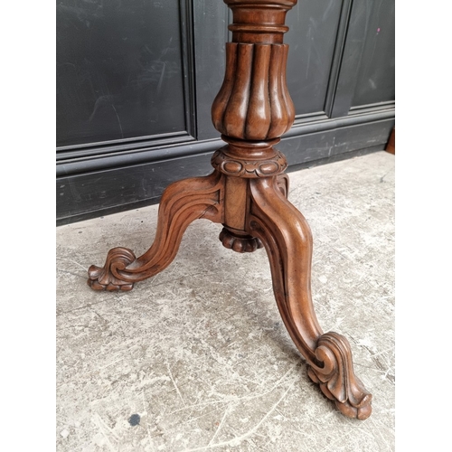 1087 - A Victorian walnut and specimen marble tripod occasional table, 67cm diameter.