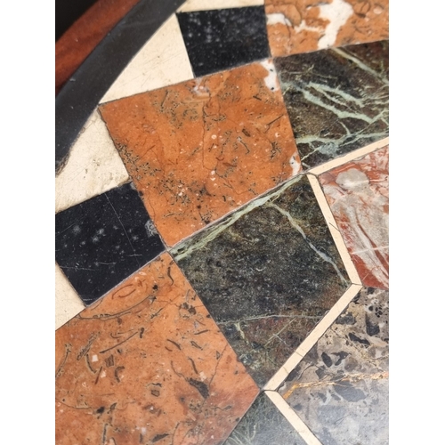 1087 - A Victorian walnut and specimen marble tripod occasional table, 67cm diameter.