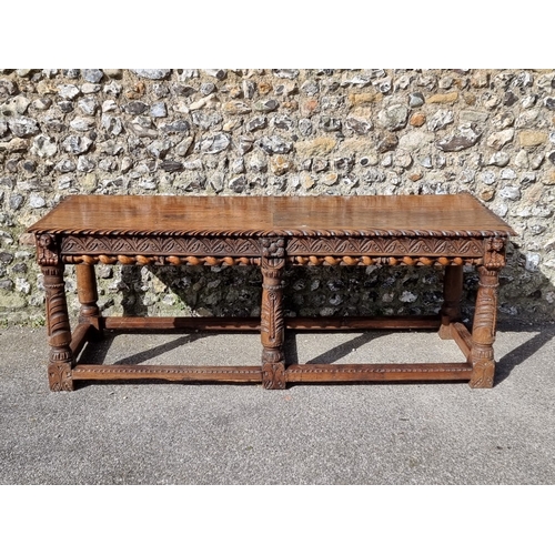 1089 - An antique carved oak refectory type table, the top 210 x 73cm, (reconstructed from old elements).... 