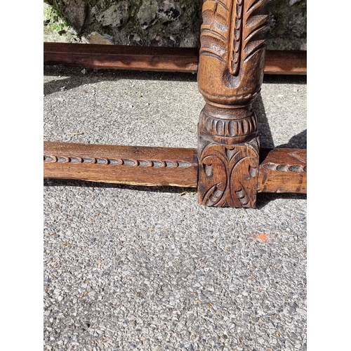 1089 - An antique carved oak refectory type table, the top 210 x 73cm, (reconstructed from old elements).... 