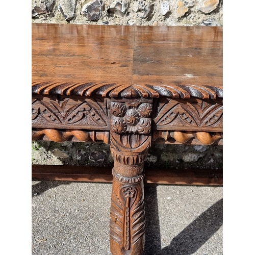 1089 - An antique carved oak refectory type table, the top 210 x 73cm, (reconstructed from old elements).... 