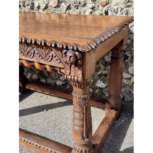 1089 - An antique carved oak refectory type table, the top 210 x 73cm, (reconstructed from old elements).... 