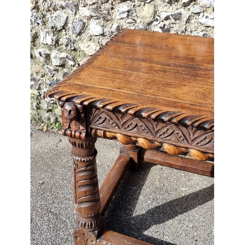 1089 - An antique carved oak refectory type table, the top 210 x 73cm, (reconstructed from old elements).... 