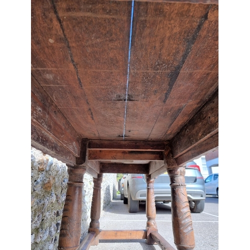 1089 - An antique carved oak refectory type table, the top 210 x 73cm, (reconstructed from old elements).... 