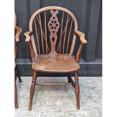 1096 - A 19th century ash, elm and beech stickback Windsor armchair; together with two similar wheelback ex... 