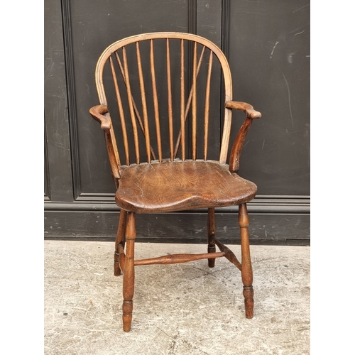 1096 - A 19th century ash, elm and beech stickback Windsor armchair; together with two similar wheelback ex... 