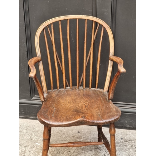 1096 - A 19th century ash, elm and beech stickback Windsor armchair; together with two similar wheelback ex... 