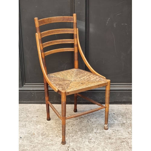 1097 - An unusual late Victorian turned mahogany, walnut and rush seated side chair.